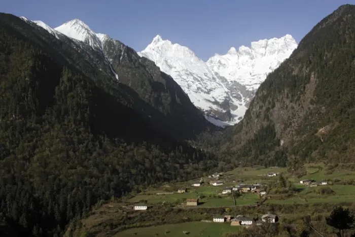 Framed Print : View of mountain valley with village at dawn, with snow covered peaks in background, Lower Yubeng Village, Miancimu