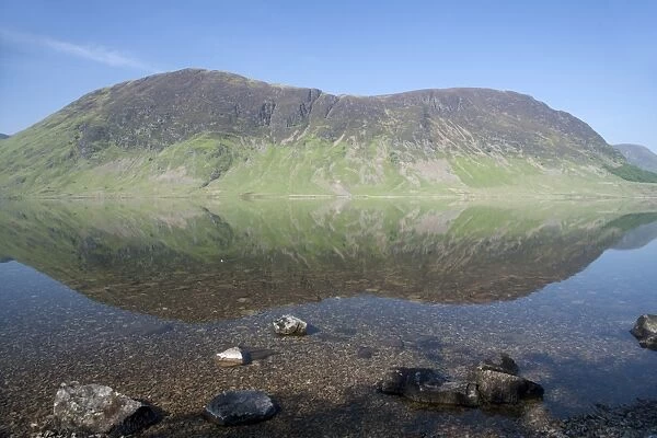 View of mountains reflected in lake, Mellbreak, Crummock Water, Lake District N. P. Cumbria, England, June