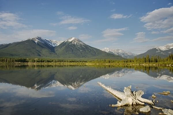 View of mountains reflected in lake, Vermillion Lakes, Banff N. P. Rocky Mountains, Alberta, Canada, june