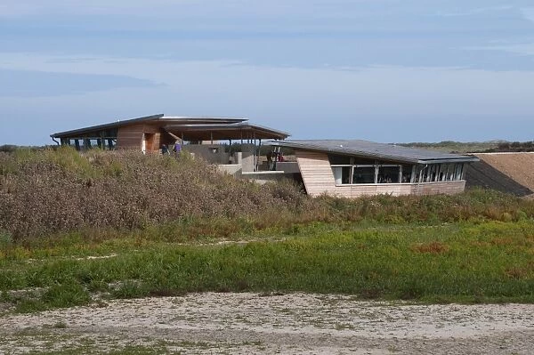 View of new hides and information centre in coastal wetland reserve, Titchwell RSPB Reserve, Norfolk, England