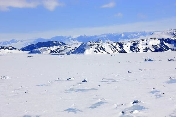 View of pack ice and snow covered mountains, Weddell Sea, Continent of Antarctica, Antarctica, December