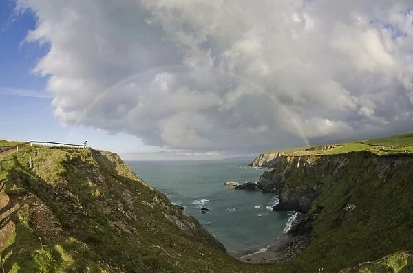 View of rainbow over coastline, Godrevy, St. Ives Bay, Cornwall, England, November