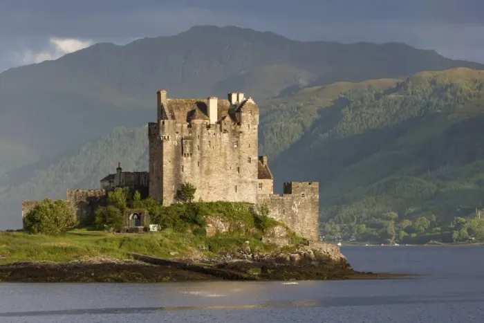 Framed Print : View of restored castle on tidal island in sea loch, in evening sunlight, Eilean Donan Castle, Loch Duich Framed Print : View of restored castle on tidal island in sea loch, in evening sunlight, Eilean Donan Castle, Loch Duich