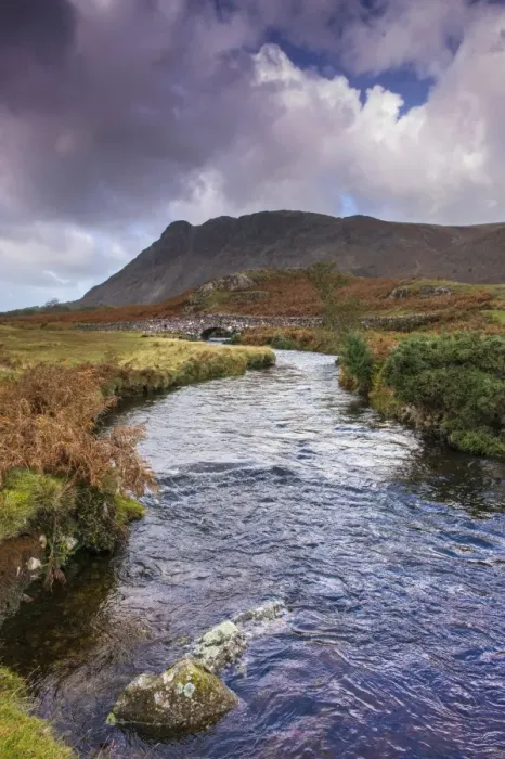 Framed Print : View of river and bridge in upland valley, with Seatallan Peak in background, Overbeck Bridge, Over Beck Framed Print : View of river and bridge in upland valley, with Seatallan Peak in background, Overbeck Bridge, Over Beck