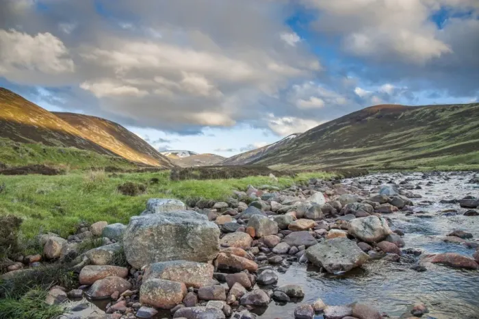 Framed Print : View of river flowing through glen, in evening sunlight, Clunie Water, near Braemar, Cairngorms N. P