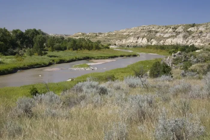 Framed Print : View of river flowing through ranch country, Little Missouri River, Badlands, North Dakota, U. S. A. august