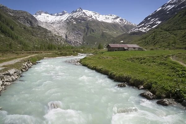 View of river in mountain valley, River Rhone, Grimsel Pass, Bernese Oberland, Switzerland, June