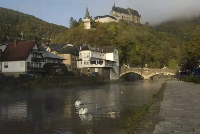 Framed Print : View of river with Mute Swans (Cygnus olor), bridge and castle, River Our, Vianden, Oesling, Luxembourg Framed Print : View of river with Mute Swans (Cygnus olor), bridge and castle, River Our, Vianden, Oesling, Luxembourg