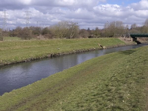 View of river and riverbanks, River Tame, Sandwell Valley RSPB Reserve, West Midlands, England, April