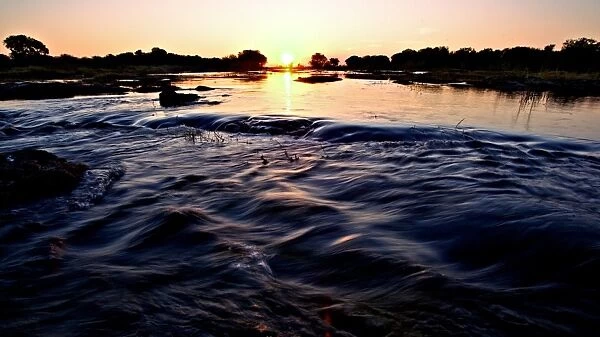 View of river at sunset, Chobe River, Chobe N. P. Botswana, July