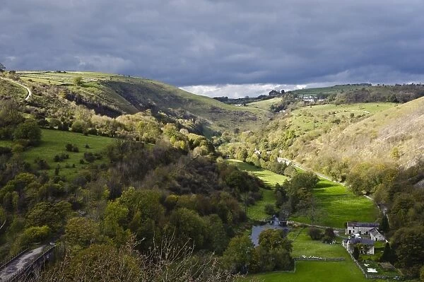 View of river valley with farm building, looking from Monsal Head, Upperdale, Peak District, Derbyshire, England