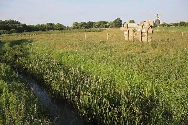 View of river, wooden information sign, fen meadow and windmill in distance, Little Ouse Headwaters Project