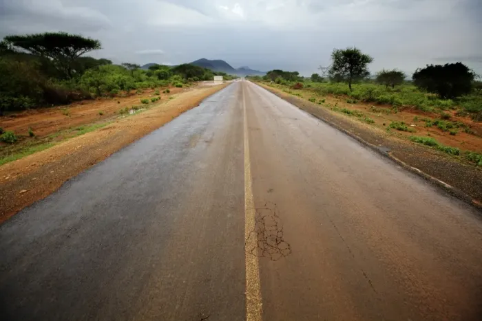 Framed Print : View of road through bush habitat after rainfall, with mountain range in distance, South Pare Mountains Framed Print : View of road through bush habitat after rainfall, with mountain range in distance, South Pare Mountains