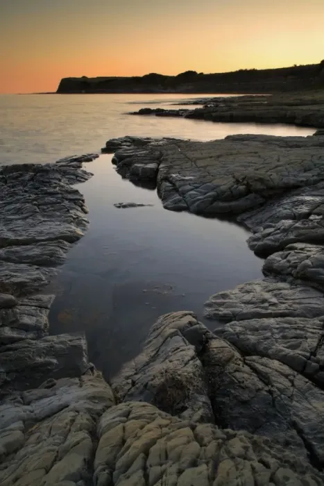 Framed Print : View of rockpool on beach at sunset, Hobarrow Bay, Isle of Purbeck, Dorset, England, july Framed Print : View of rockpool on beach at sunset, Hobarrow Bay, Isle of Purbeck, Dorset, England, july
