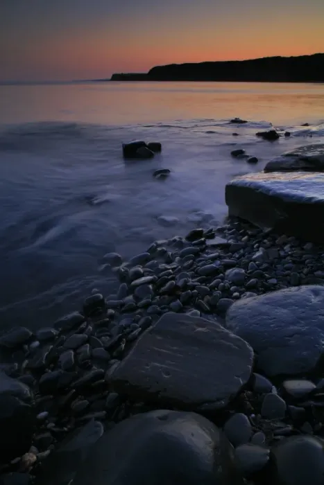 Framed Print : View of rocky beach with afterglow at sunset, Kimmeridge Bay, Isle of Purbeck, Dorset, England, july Framed Print : View of rocky beach with afterglow at sunset, Kimmeridge Bay, Isle of Purbeck, Dorset, England, july