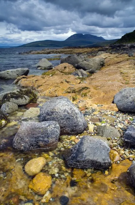 Framed Print : View of rocky coastline, with Beinn Bharrain mountain in distance, Machrie Bay, Isle of Arran, Firth of Clyde Framed Print : View of rocky coastline, with Beinn Bharrain mountain in distance, Machrie Bay, Isle of Arran, Firth of Clyde