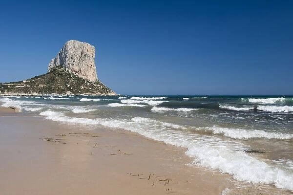 View of sandy beach and massive limestone outcrop, Penyal d Ifac, Calpe, Marina Alta, Costa Blanca, Alicante Province