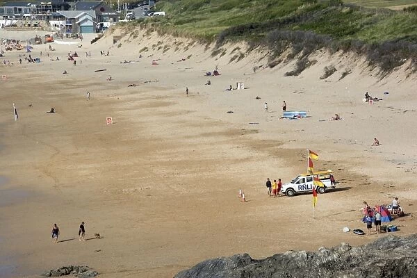 View of sandy beach with RNLI Lifeguards on standby, Fistral Beach, Fistral Bay, Newquay, Cornwall, England, July
