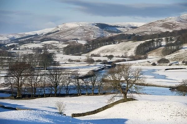 View of snow covered farmland and hills, Upper Wensleydale, North Yorkshire, England, December