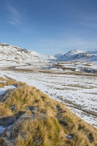 View of snow covered upland habitat with river, looking towards Glenshee Ski Resort, Clunie Water, Cairngorm Mountains