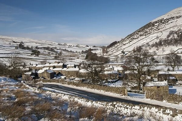 View of snow covered village, Thwaite, Swaledale, Yorkshire Dales N. P. North Yorkshire, England, January