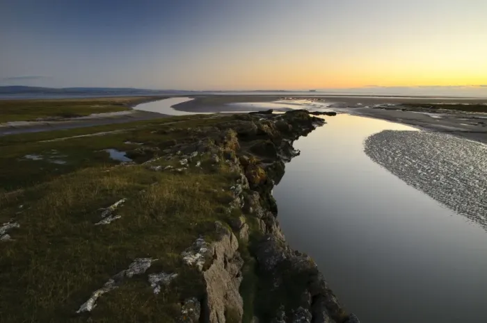 Framed Print : View of spit projecting into bay at dusk, Humphrey Head, Morecambe Bay, Cumbria, England, December