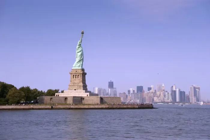 Framed Print : View of Statue of Liberty, with Manhattan Island city skyline in distance, Liberty Island, New York Harbor Framed Print : View of Statue of Liberty, with Manhattan Island city skyline in distance, Liberty Island, New York Harbor