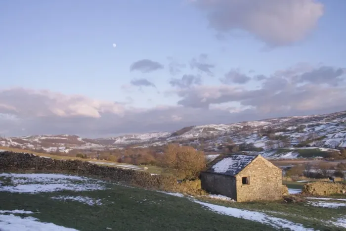 Framed Print : View of stone barn, drystone walls, grazing sheep, trees and River Swale in vallley bottom after snowfall Framed Print : View of stone barn, drystone walls, grazing sheep, trees and River Swale in vallley bottom after snowfall