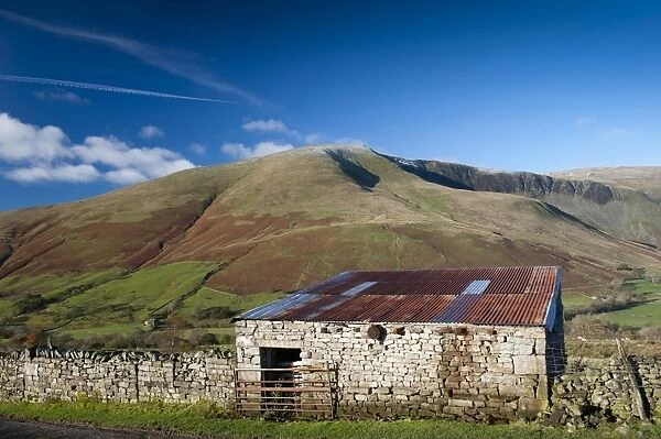 View of stone barn and farmland in fell valley, looking from Bluecaster, Cautley Crag, Sedbergh, Howgill Fells