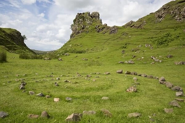 View of stone circle and rock outcrop tower formation, Castle Ewen, Fairy Glen, Trotternish Peninsula, Isle of Skye