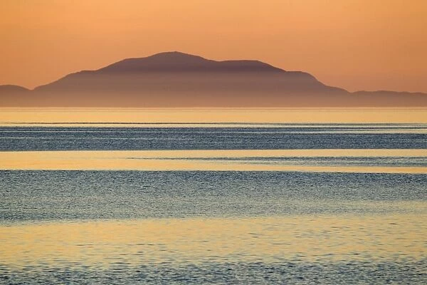 View across strait towards North Uist after sunset, Lower Minch, Isle of Skye, Inner Hebrides, Scotland, June