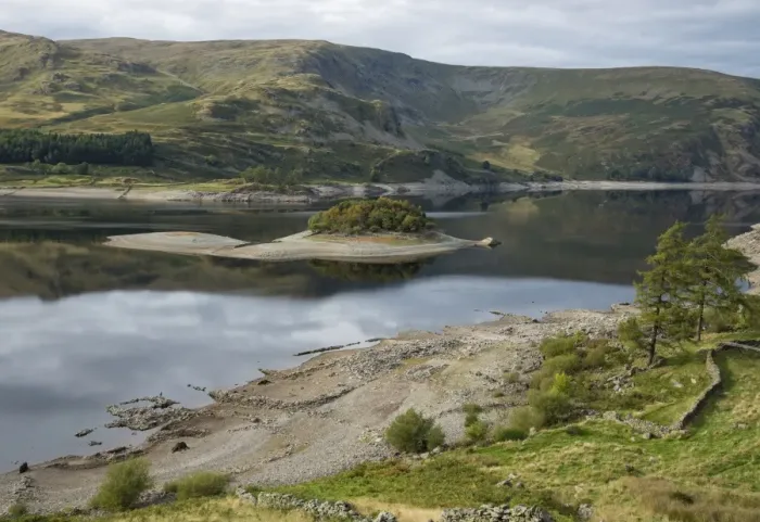 Framed Print : View of upland reservoir with low water level and remains of submerged village exposed after dry summer, Mardale Green Framed Print : View of upland reservoir with low water level and remains of submerged village exposed after dry summer, Mardale Green