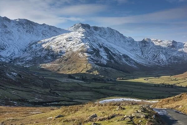 View across valley towards snow covered fell, Langdale Fell, Great Langdale, Lake District N. P