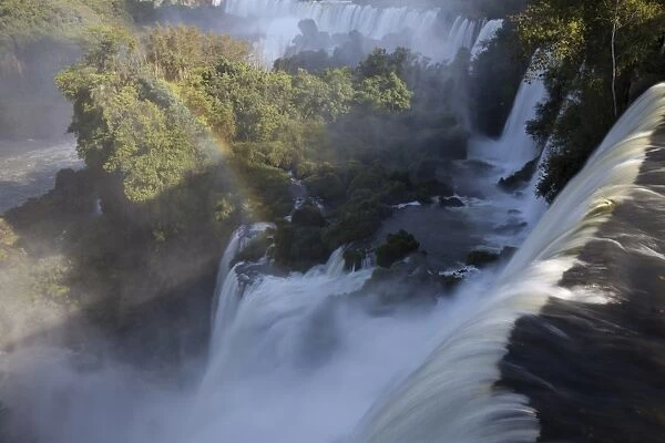 View of waterfall with rainbow, Iguazu Falls, Iguazu N. P. Argentina