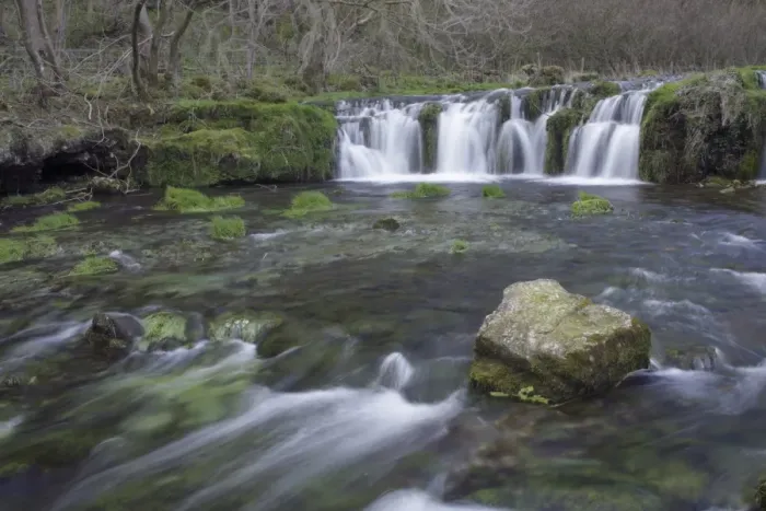Framed Print : View of waterfall and rock in river, River Lathkill, Lathkill Dale Nature Reserve, Peak District, Derbyshire, England Framed Print : View of waterfall and rock in river, River Lathkill, Lathkill Dale Nature Reserve, Peak District, Derbyshire, England