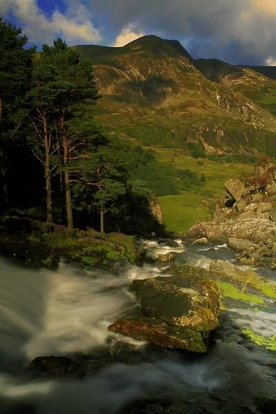 View of waterfall in valley with mountain in background, Ogwen Falls, Afon Ogwen, Mynydd Perfedd, Snowdonia, Wales