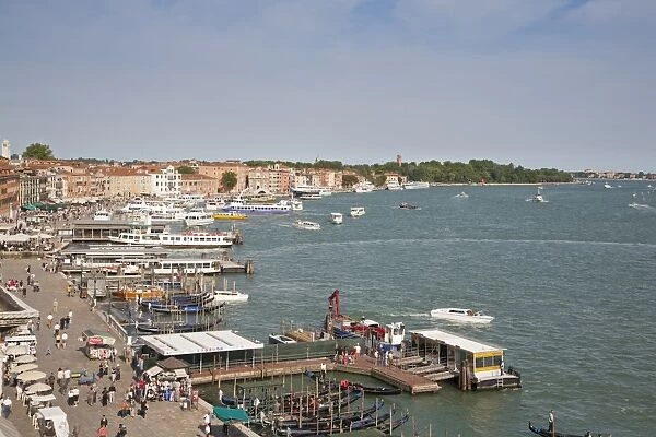 View of waterfront with gondolas and tour boats, looking from roof of Hotel Danielli, Riva Degli Schiavoni