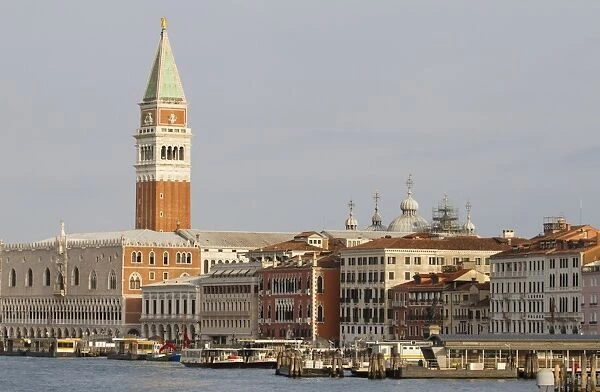 View across waterfront towards palace and cathedral belltower, Doges Palace, St. Marks Campanile, St