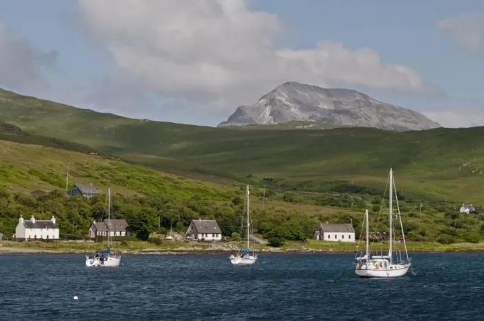 Framed Print : View of yachts moored in bay, with Beinn an Oir, Paps of Jura in background, Craighouse Bay, Isle of Jura Framed Print : View of yachts moored in bay, with Beinn an Oir, Paps of Jura in background, Craighouse Bay, Isle of Jura