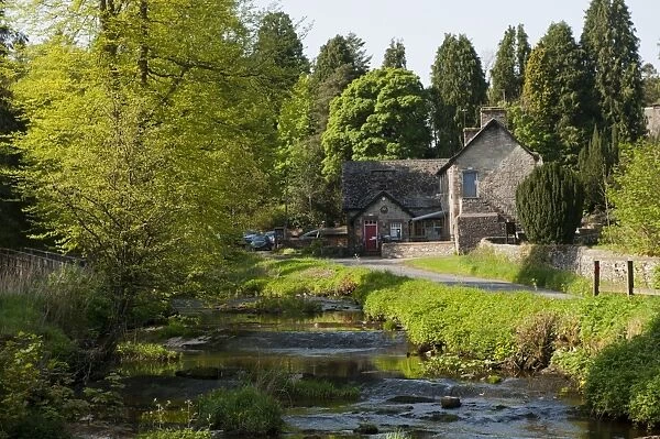 Village primary school beside river in rural setting, Ravenstonedale, Westmorland, Cumbria, England, May