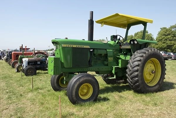 Vintage John Deere tractors with others at display, Honiton Show, East Devon, England, August