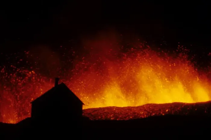 Framed Print : Volcanic eruption, erupting lava with town house silhouetted, Eldfell Volcano, Heimaey, Westmann Isles, Iceland, 1973 Framed Print : Volcanic eruption, erupting lava with town house silhouetted, Eldfell Volcano, Heimaey, Westmann Isles, Iceland, 1973
