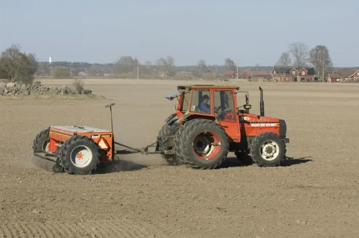 Framed Print : Volvo BM Valmet 705 tractor pulling Tume HKL-4000 seed drill, drilling field, Sweden, spring