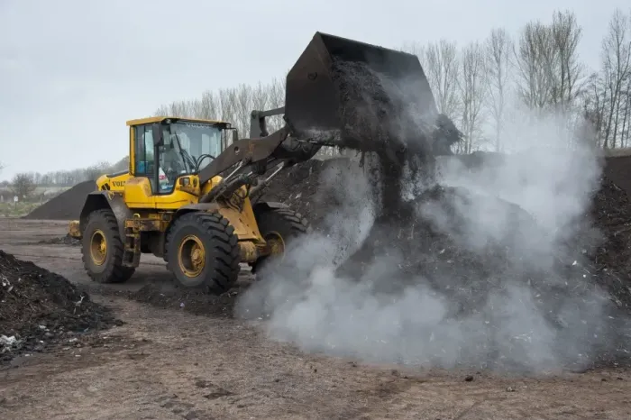Framed Print : Volvo loader turning green compost waste for aeration at municipal waste site, near Chester, Cheshire, England, march Framed Print : Volvo loader turning green compost waste for aeration at municipal waste site, near Chester, Cheshire, England, march