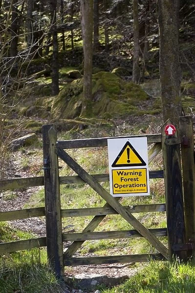 Warning, Forest Operations sign on footpath gate, England, april