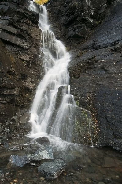 Waterfall cascading down rocks, Lapland, North Norway, September