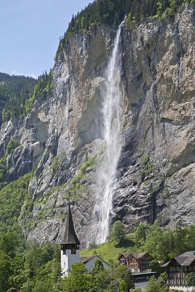 Waterfall flowing over mountain cliff, Staubbach Falls, Lauterbrunnen, Bernese Alps, Switzerland, June