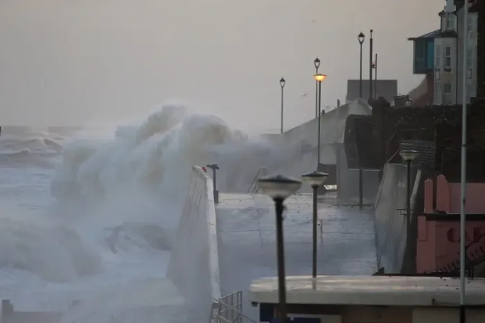 Framed Print : Waves crashing against seawall of seaside town during tidal surge, Sheringham, North Norfolk, England, December 2013
