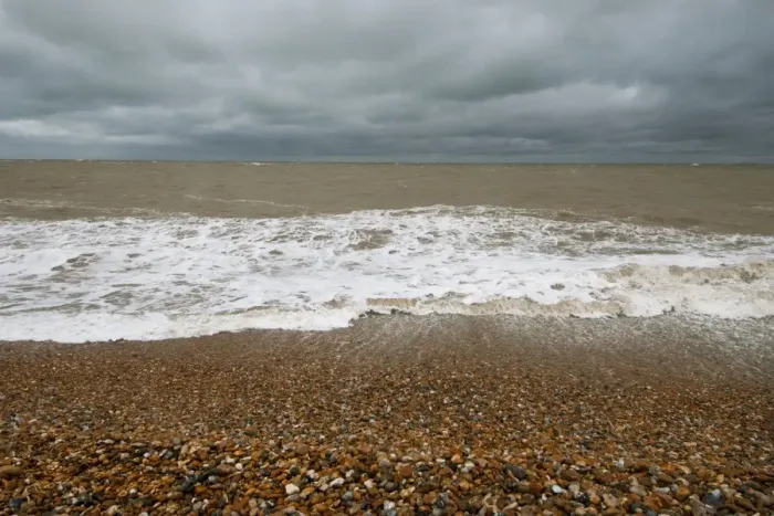 Framed Print : Waves crashing against shoreline of shingle beach, Dungeness, Kent, England, June