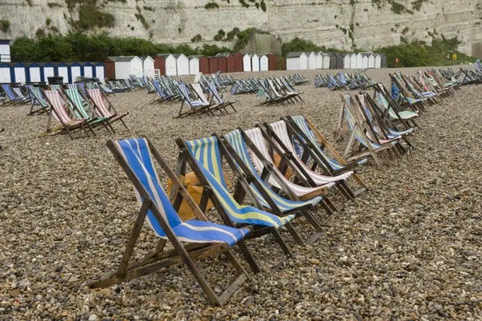 Framed Print : Wet summer day with unused deck chairs, Beer Beach, Devon, England, May Framed Print : Wet summer day with unused deck chairs, Beer Beach, Devon, England, May